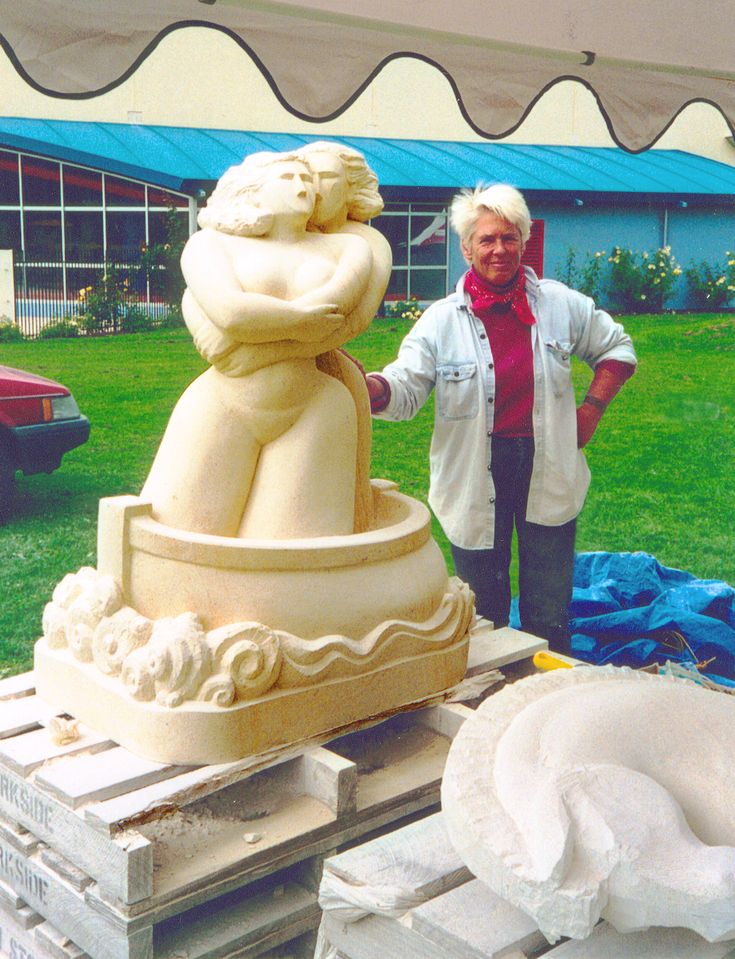 Angela Treat Lyon with "La Balanza" at the Oamaru Stone Carving Symposium in New Zealand, 2002 Angela Treat Lyon with La Balanza