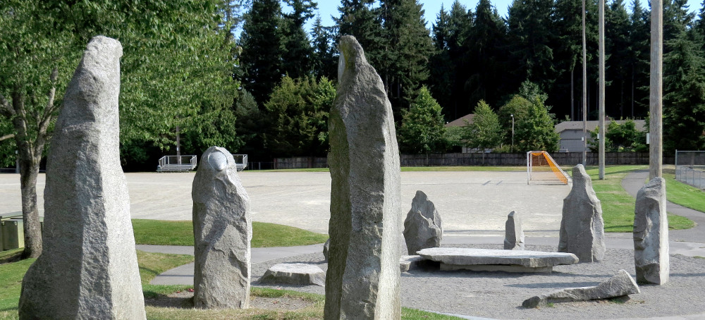 “Community”, granite, family grouping as part of an art installation at Meadowdale high school Playfields in Lynnwood, WA. largest figure about 7' H, smallest is about 4' H.