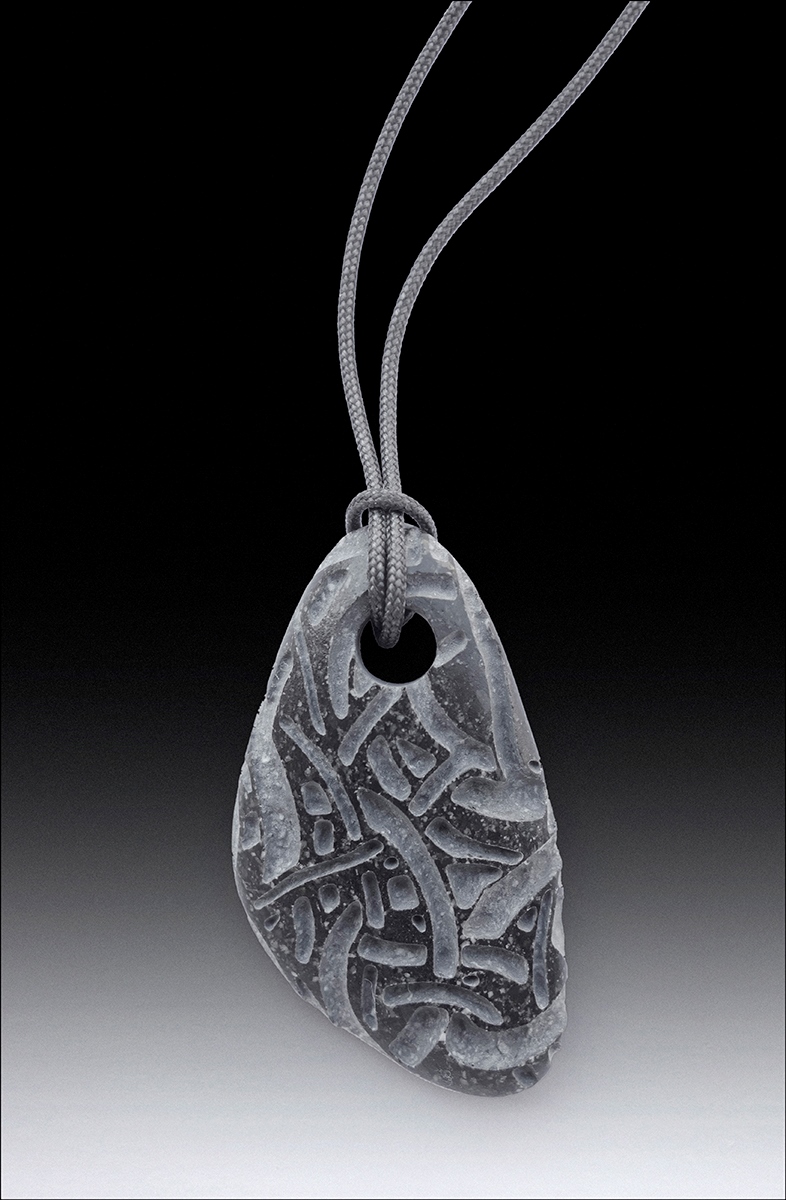 Beach pebble pendants, basalt, each about 2” long.