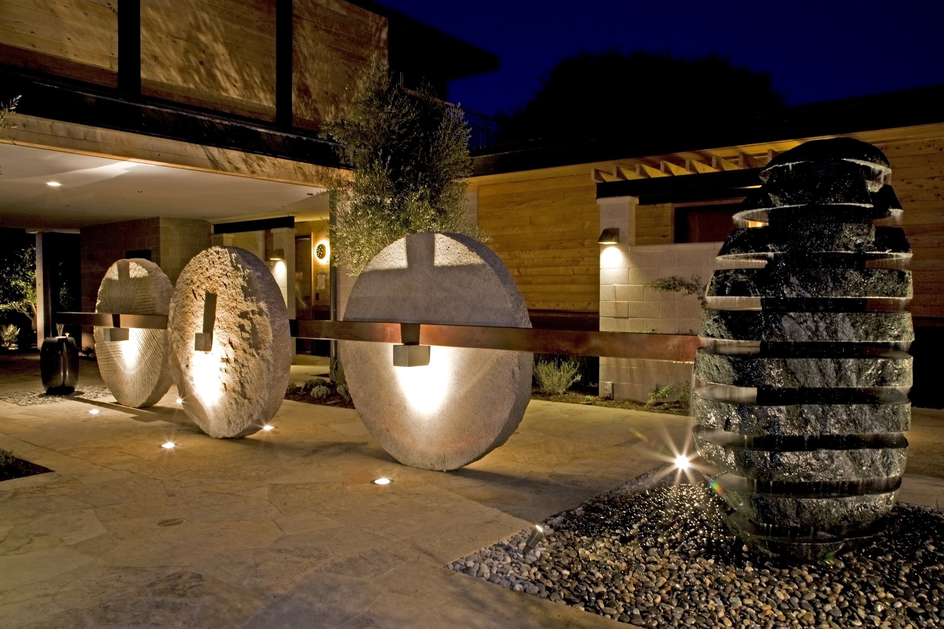 This fountain, featuring wheat grinding stones, was designed and installed in the Olive Courtyard of the Bardessono Hotel.