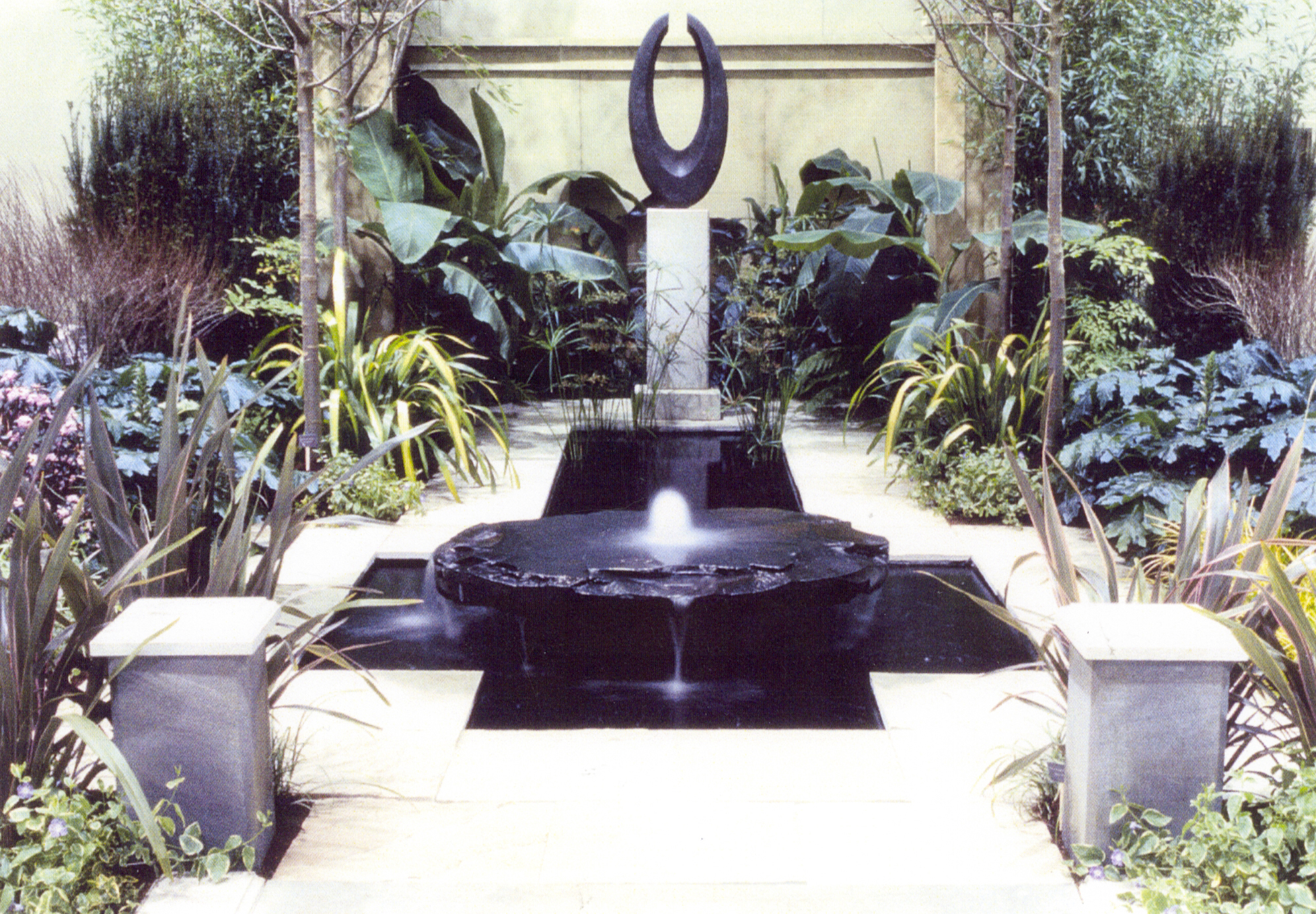 Display gardens Rich created for the Northwest Flower and Garden Show in Seattle. This was a gold medal, award winning design.  "Threshold" a black granite sculpture by Jim Ballard. 