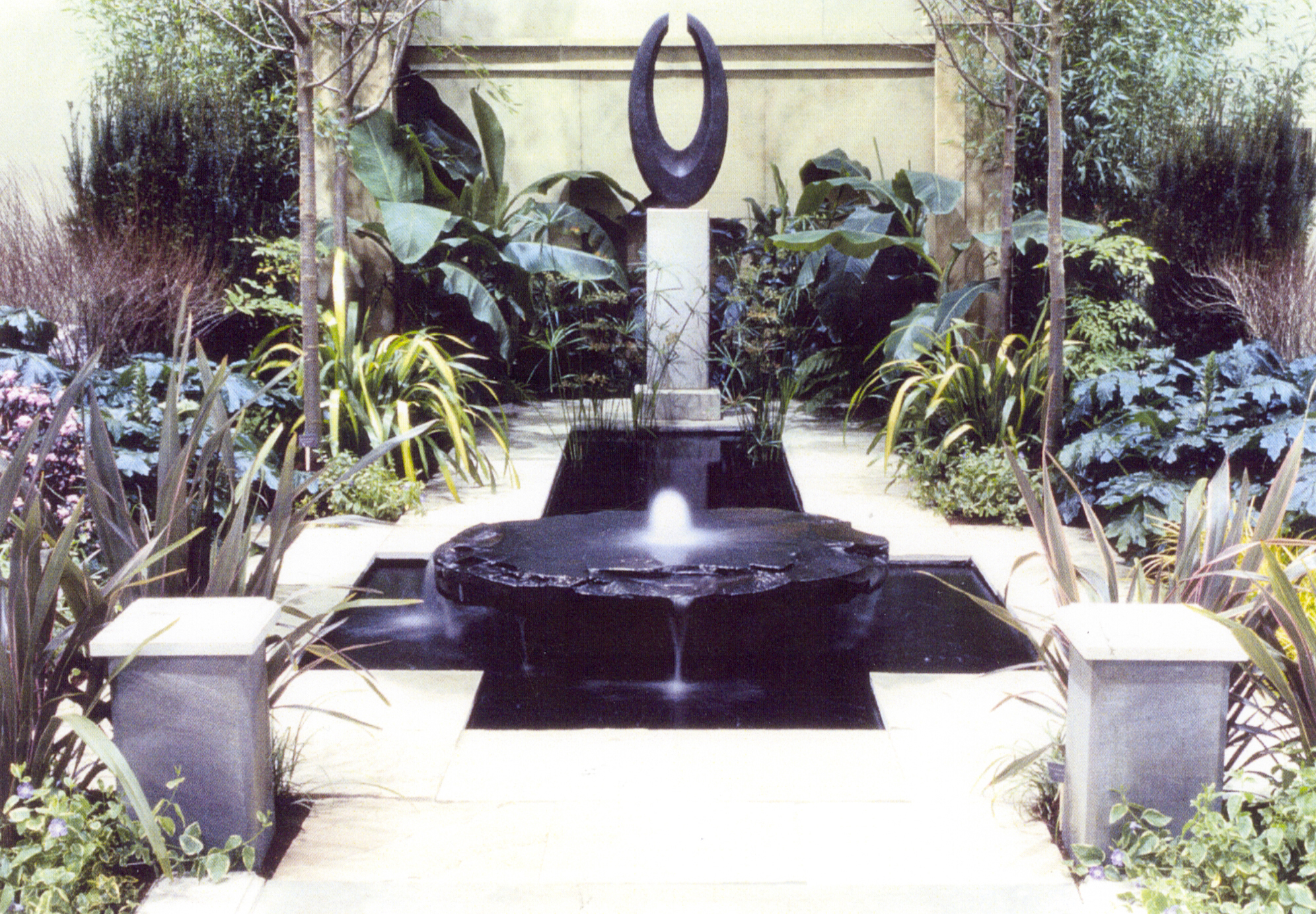 Display gardens Rich created for the Northwest Flower and Garden Show in Seattle. This was a gold medal, award winning design. "Threshold" a black granite sculpture by Jim Ballard.