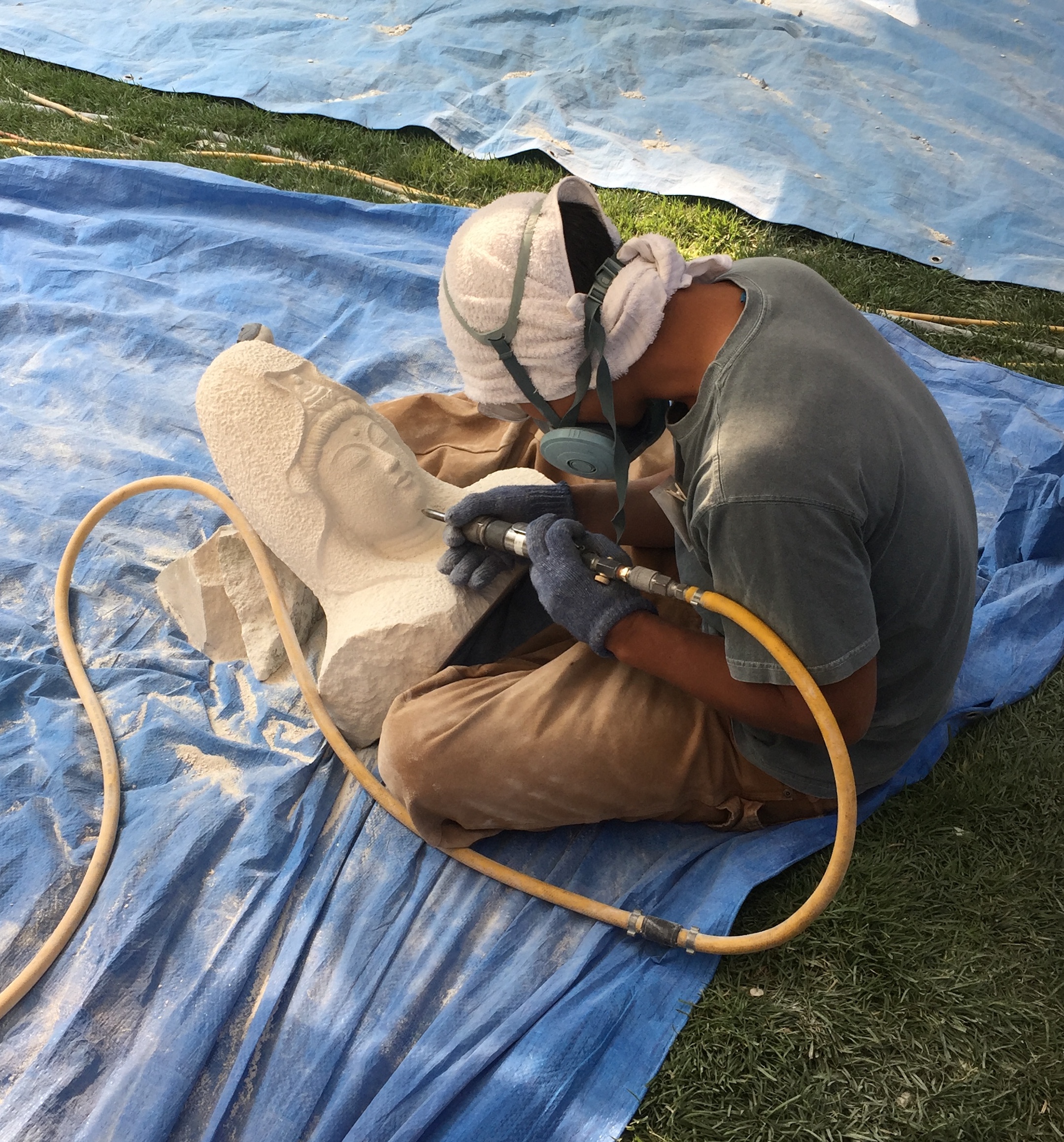 Carving a Buddha: Mitsuo Saikai carving a Buddha in Texas limestone